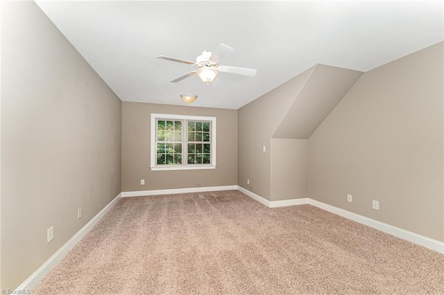 5216 Harley Stafford Dr, Oak Ridge, NC 27310 - bonus room with a ceiling fan, light colored carpet, and lofted ceiling