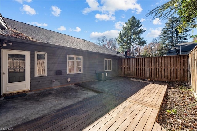 wooden deck featuring central AC unit