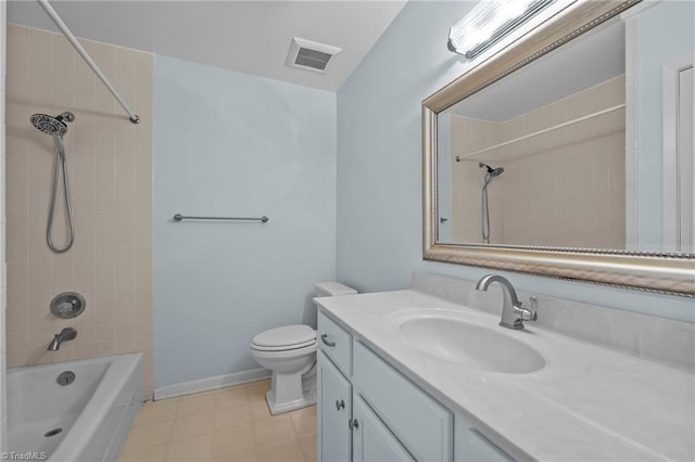 full bathroom with vanity, tiled shower / bath combo, and toilet