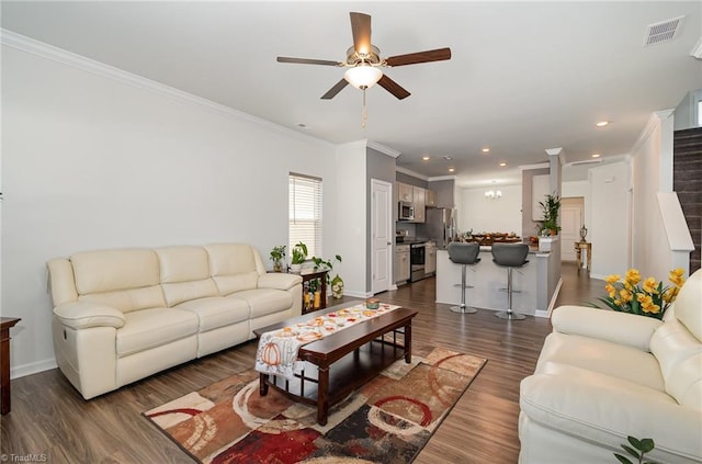 living room featuring ceiling fan, crown molding, and dark hardwood / wood-style flooring