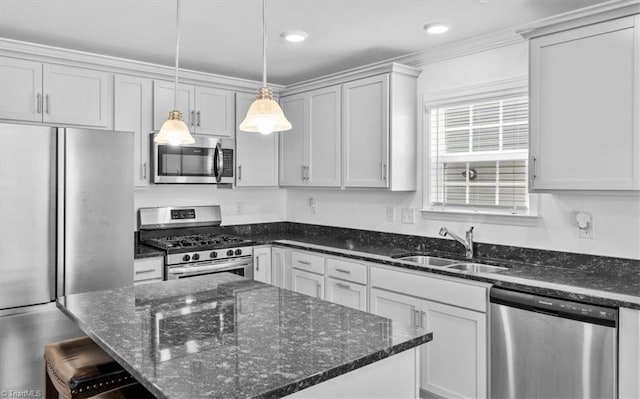 824 Sage Hill Dr, Jamestown, NC 27282 - kitchen with appliances with stainless steel finishes, pendant lighting, dark stone counters, a kitchen island, and a kitchen breakfast bar