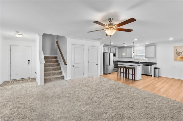 824 Sage Hill Dr, Jamestown, NC 27282 - living area with recessed lighting, a ceiling fan, stairway, crown molding, and light wood-style flooring