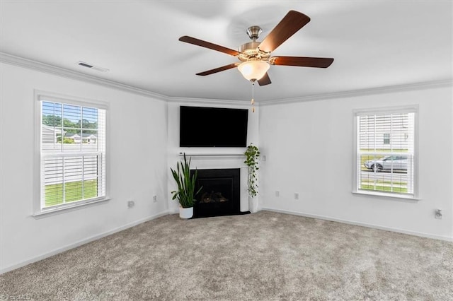 824 Sage Hill Dr, Jamestown, NC 27282 - unfurnished living room with crown molding, carpet floors, a fireplace with flush hearth, and a ceiling fan