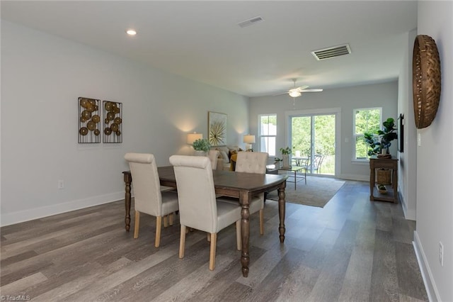 dining space featuring wood finished floors, baseboards, a ceiling fan, and recessed lighting