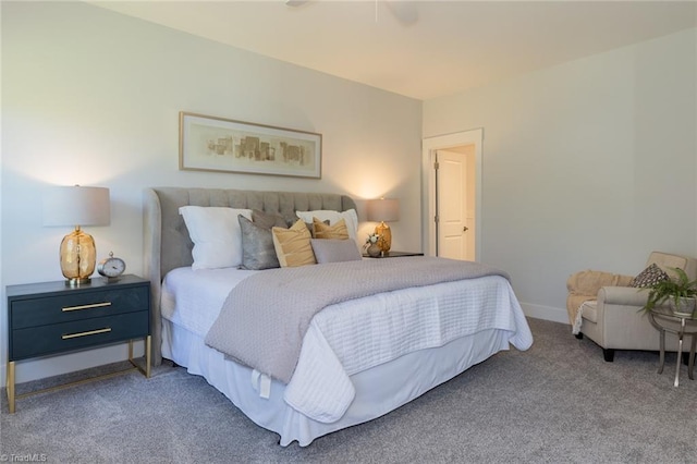 bedroom with carpet floors and baseboards