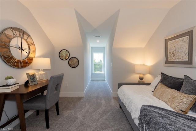 bedroom with carpet floors, lofted ceiling, and baseboards