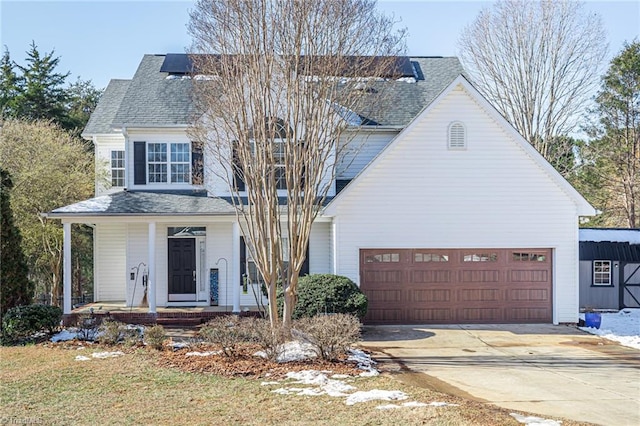 view of front of house featuring a porch and a garage