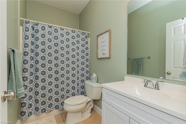 bathroom featuring a shower with curtain, toilet, vanity, tile patterned flooring, and baseboards