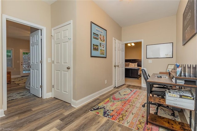 office with baseboards and wood finished floors