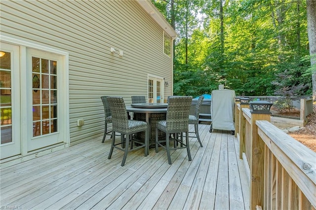 wooden deck with outdoor dining space