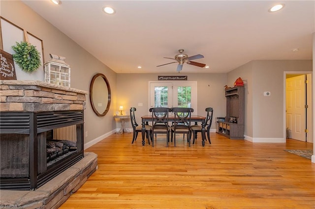 dining space featuring a ceiling fan, recessed lighting, baseboards, and light wood finished floors