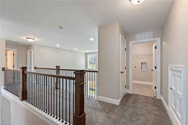 corridor with carpet floors