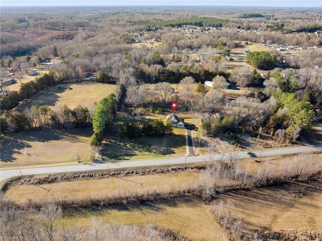 birds eye view of property featuring a rural view