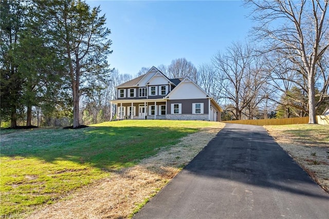 view of front of property with a front lawn and a porch