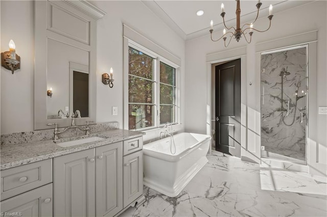 bathroom with vanity, separate shower and tub, and an inviting chandelier