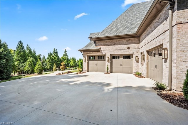 view of side of property featuring a garage