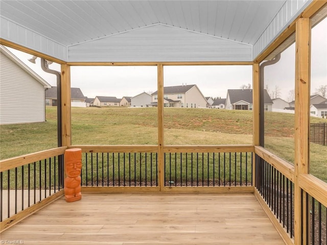 wooden deck with a residential view and a lawn