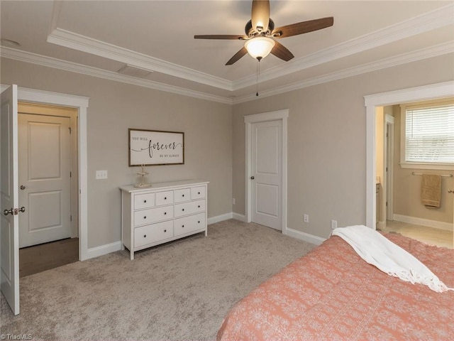 bedroom with baseboards, light colored carpet, ensuite bath, and crown molding