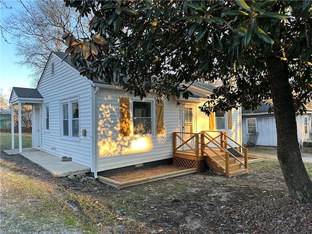 back of house with crawl space