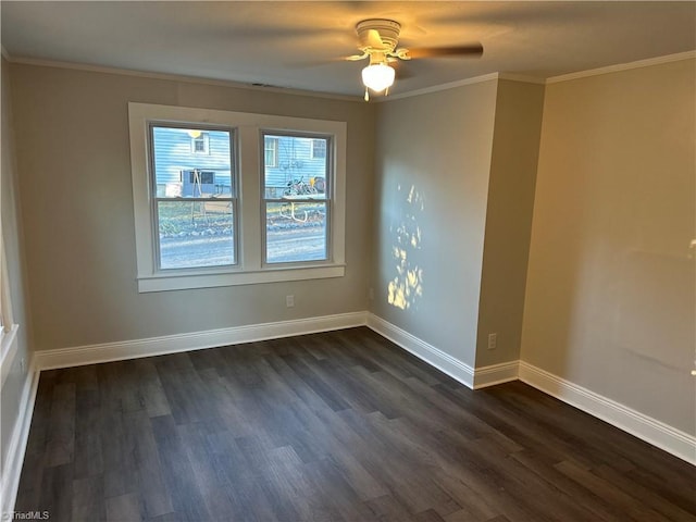 empty room featuring ceiling fan, baseboards, dark wood finished floors, and crown molding