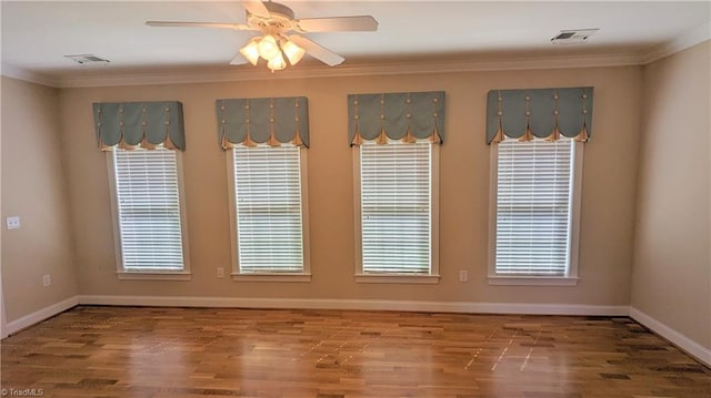 unfurnished room with crown molding, hardwood / wood-style floors, and ceiling fan