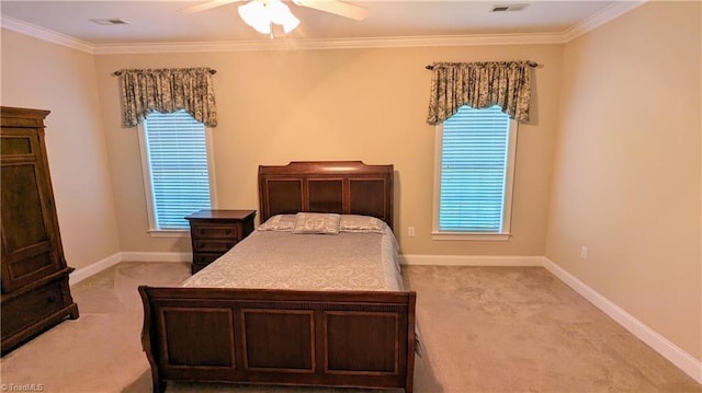 carpeted bedroom featuring ceiling fan and crown molding