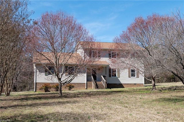 view of front facade with a front yard and crawl space