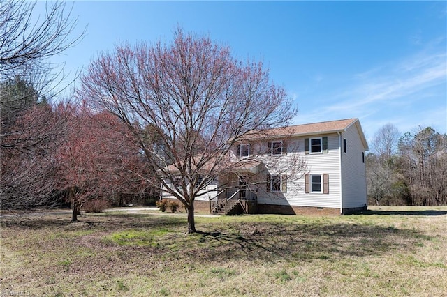 exterior space featuring a front yard and crawl space