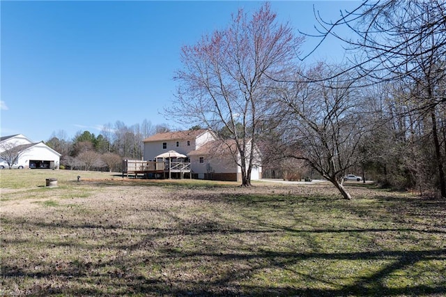 view of yard with a wooden deck