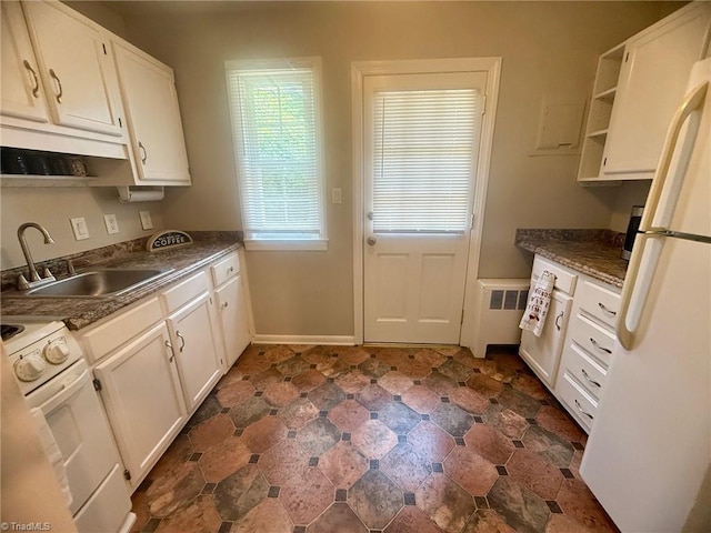 1500 Brent Ct Unit 9-B, Burlington, NC 27215 - kitchen featuring white appliances, a sink, open shelves, and white cabinets