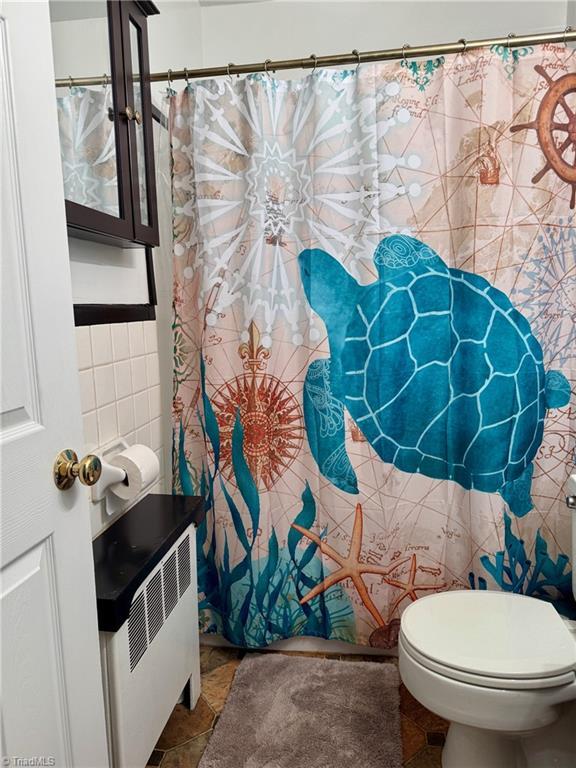 1500 Brent Ct Unit 9-B, Burlington, NC 27215 - full bathroom featuring tile walls and toilet