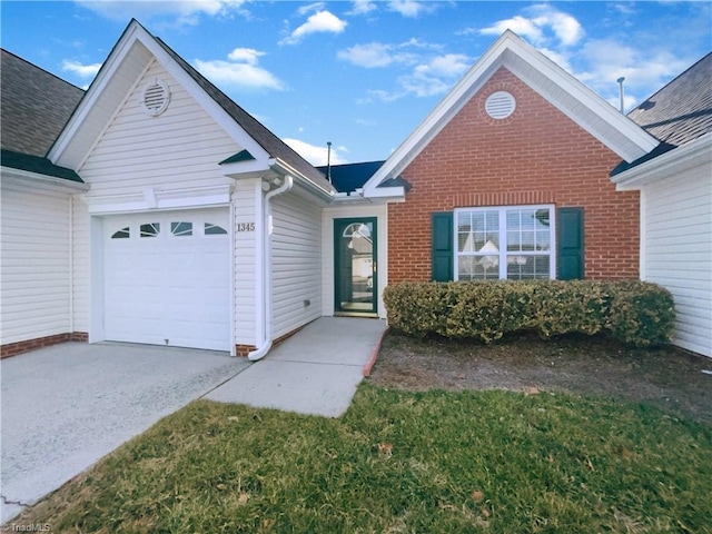 ranch-style home featuring brick siding, an attached garage, and concrete driveway