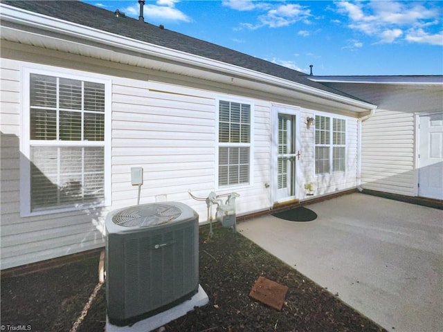 exterior space with a patio area and cooling unit