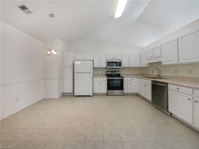 kitchen with visible vents, light countertops, stainless steel appliances, white cabinetry, and a sink