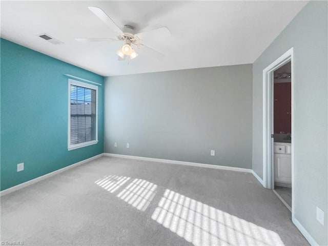 unfurnished bedroom with visible vents, baseboards, carpet floors, and a ceiling fan