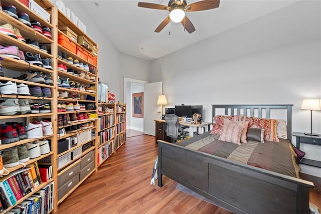 bedroom with ceiling fan and dark hardwood / wood-style flooring