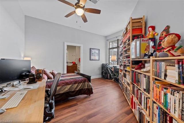 bedroom with ceiling fan, hardwood / wood-style flooring, and ensuite bathroom