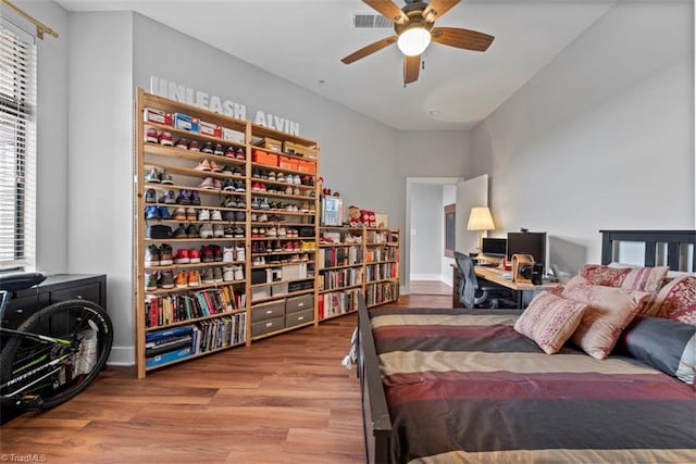 bedroom featuring hardwood / wood-style floors and ceiling fan