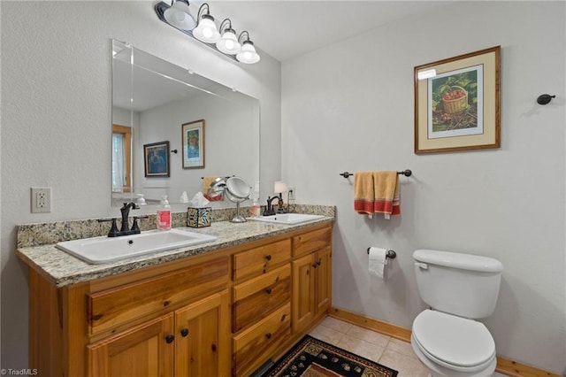 201 Cherokee Cir, Jefferson, NC 28640 - full bathroom featuring double vanity, toilet, baseboards, and tile patterned flooring