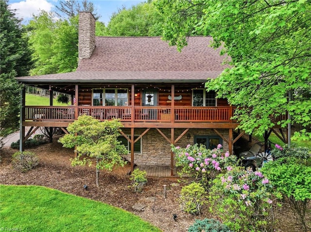 201 Cherokee Cir, Jefferson, NC 28640 - rear view of house featuring a wooden deck, a chimney, stone siding, and a shingled roof