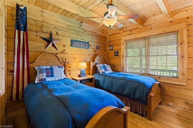 201 Cherokee Cir, Jefferson, NC 28640 - bedroom featuring wooden walls, wood ceiling with exposed beams, wood finished floors, and a ceiling fan