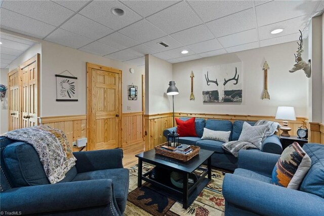 201 Cherokee Cir, Jefferson, NC 28640 - living room with wainscoting, a drop ceiling, wood walls, wood finished floors, and recessed lighting