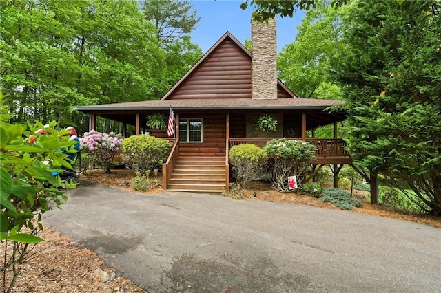 201 Cherokee Cir, Jefferson, NC 28640 - rustic home featuring covered porch, a chimney, and stairs