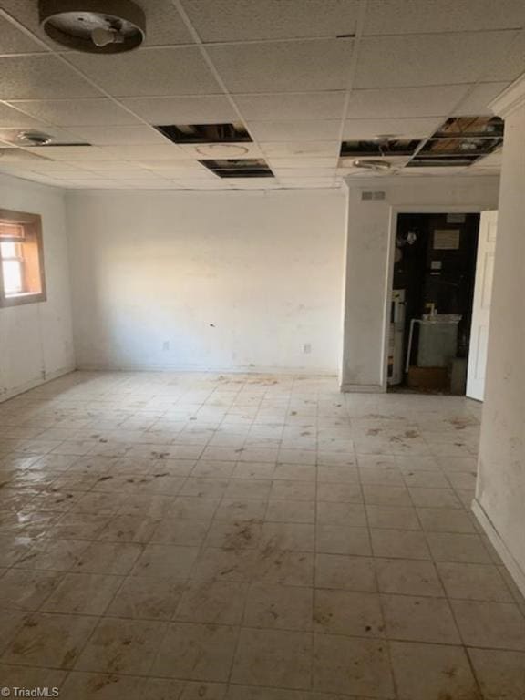 spare room featuring a paneled ceiling