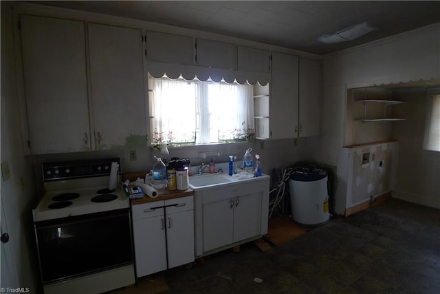 kitchen featuring sink, white cabinetry, and electric stove