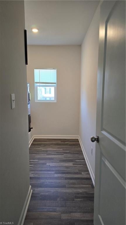 laundry area with dark hardwood / wood-style floors