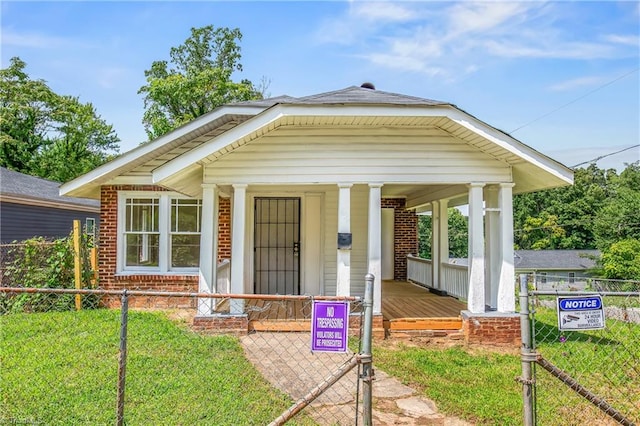 view of front of home with a front lawn and a porch