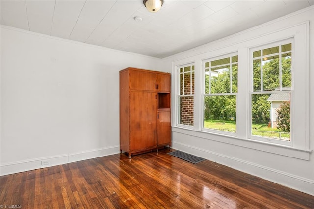 empty room featuring dark hardwood / wood-style flooring