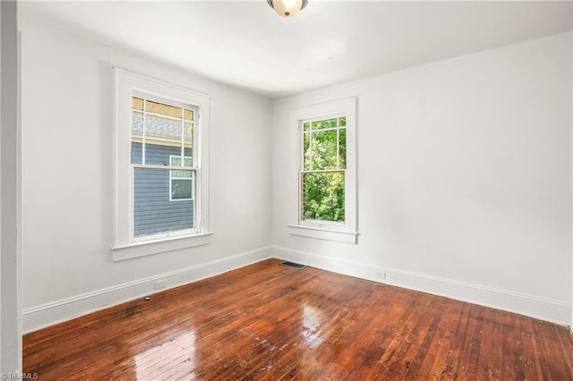 unfurnished room featuring hardwood / wood-style floors