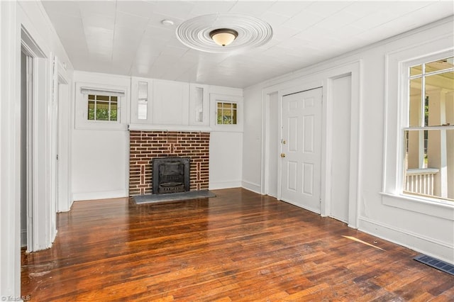 unfurnished living room featuring hardwood / wood-style floors and a fireplace